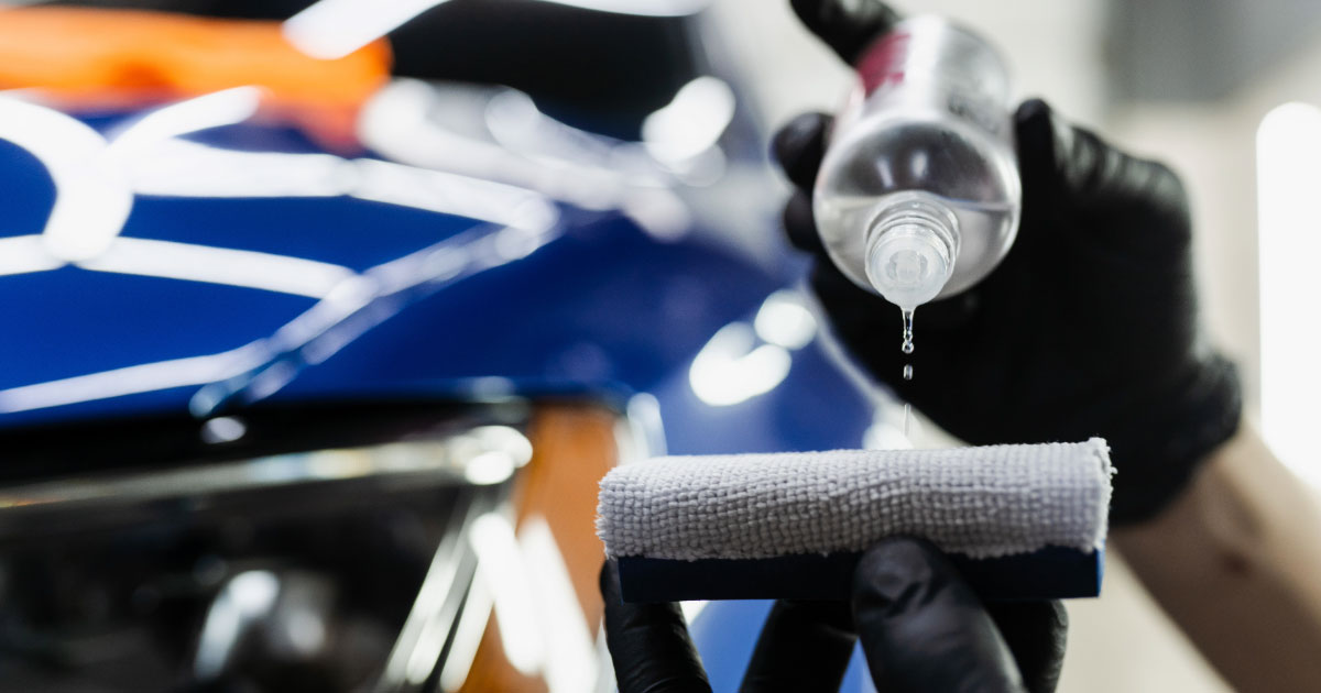 Man adding ceramic coating to applicator