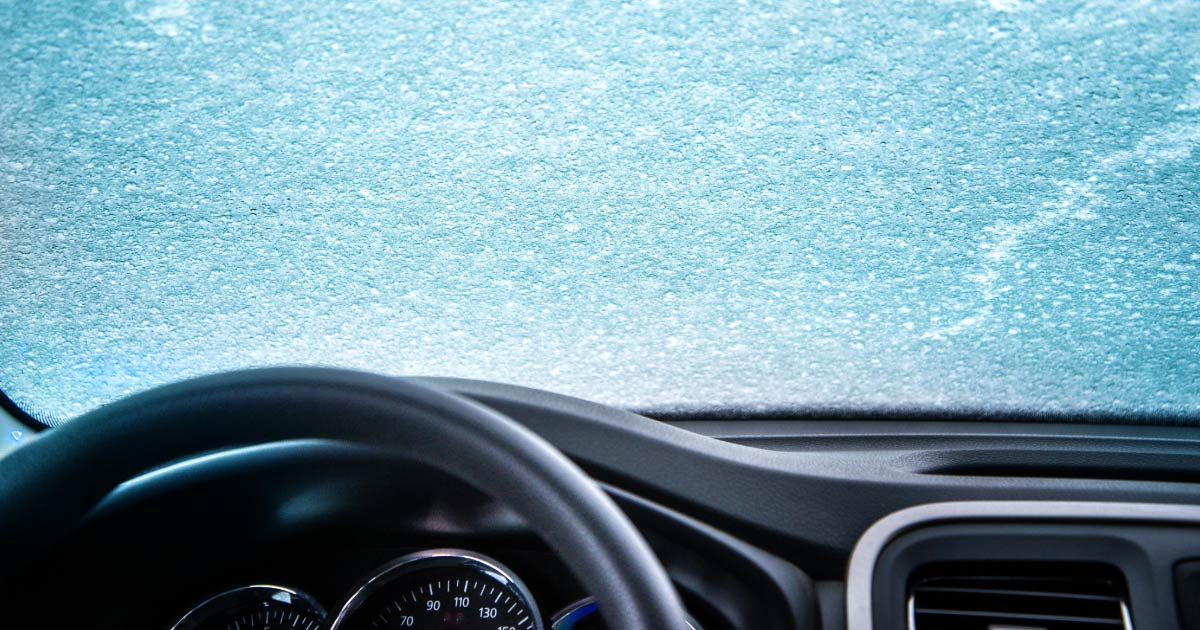 Picture taken of ice on a windshield taken from interior of car