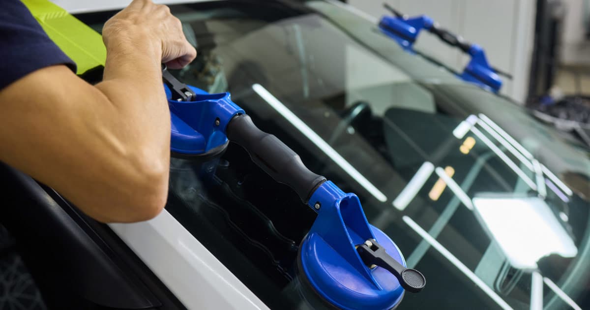 New windshield being installed on vehicle