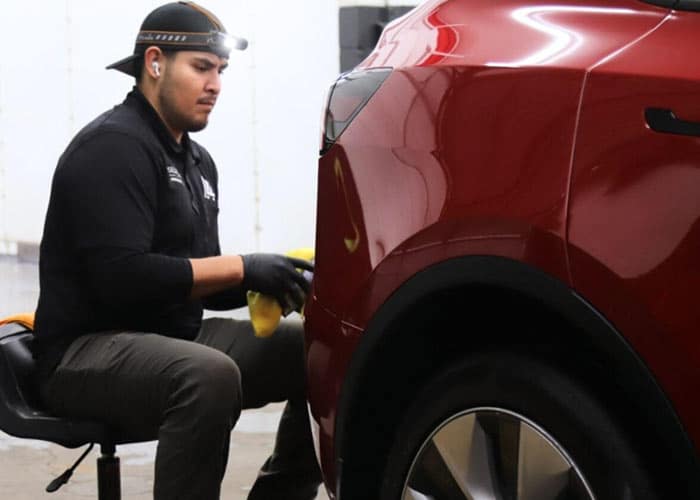 Man applying ceramic coating to car